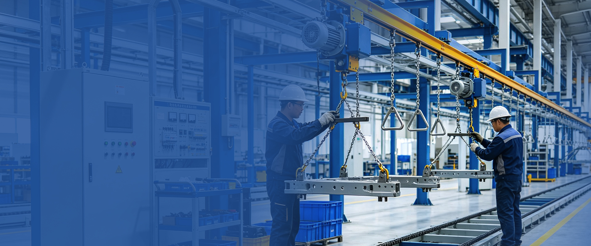 Technicians guiding a heavy truck frame component on a suspended chain conveyor in a production line